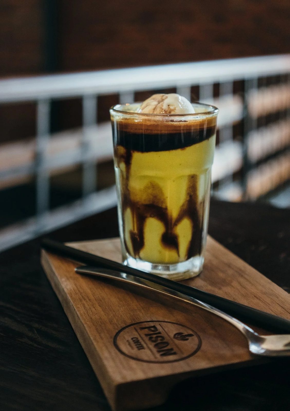 Espresso Avocado — Pison signature drink served on a branded wood board
